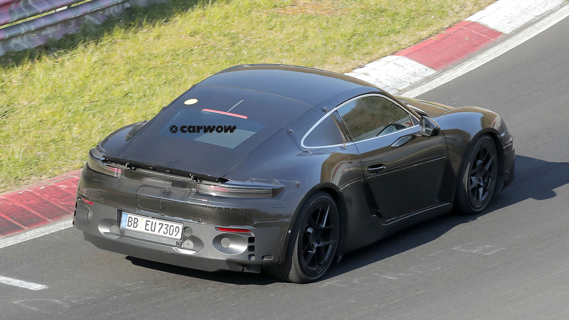 Porsche 718 Cayman Electric on test drive 2025 dynamic rear view